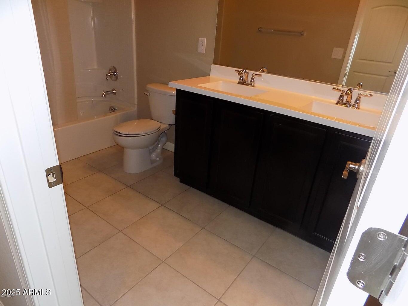 1367 South Country Club Drive, Unit 1076 Mesa, AZ 85210 - Photo 22 of 33 a bathroom with a sink and a toilet