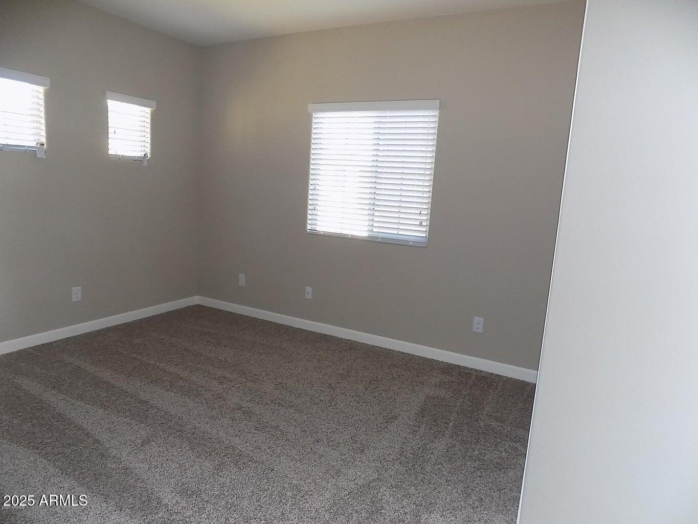 1367 South Country Club Drive, Unit 1076 Mesa, AZ 85210 - Photo 24 of 33 an empty room with a window