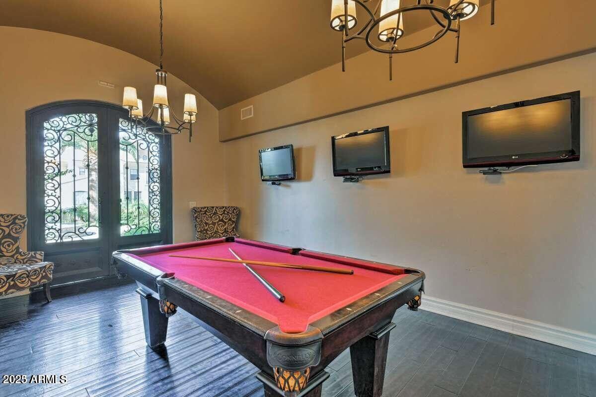 1367 South Country Club Drive, Unit 1076 Mesa, AZ 85210 - Photo 30 of 33 a room with pool table and windows