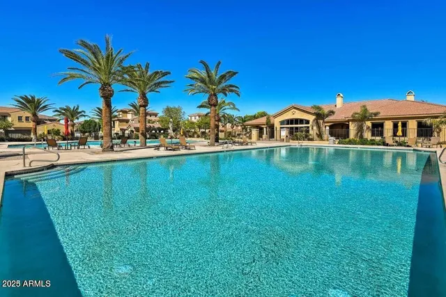a view of a swimming pool with a lounge chair