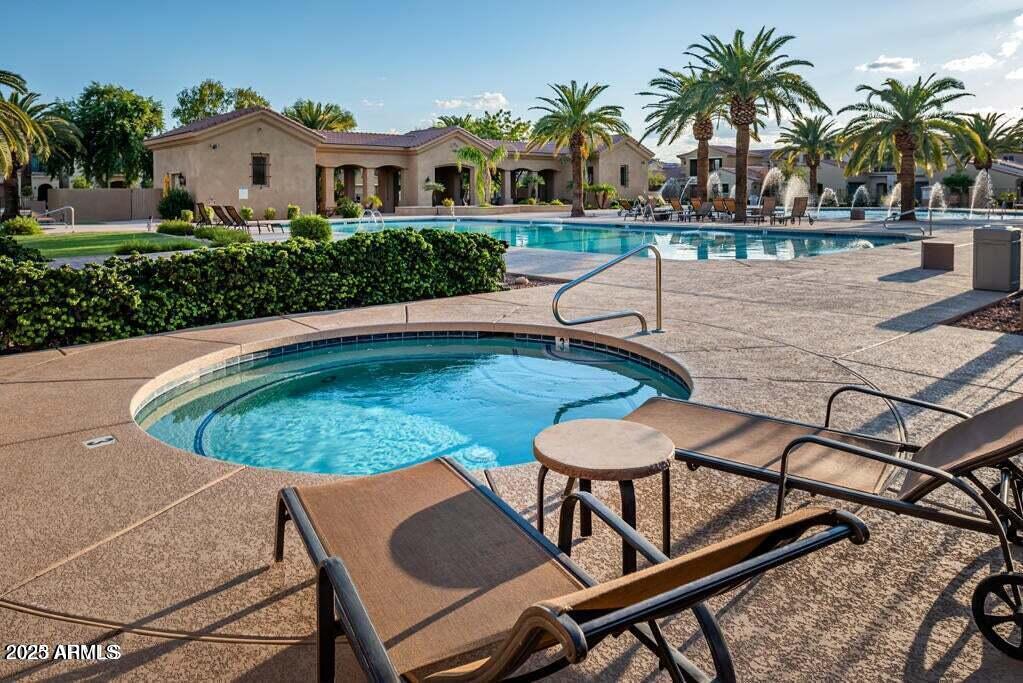1367 South Country Club Drive, Unit 1076 Mesa, AZ 85210 - Photo 33 of 33 a view of a swimming pool with a lounge chair