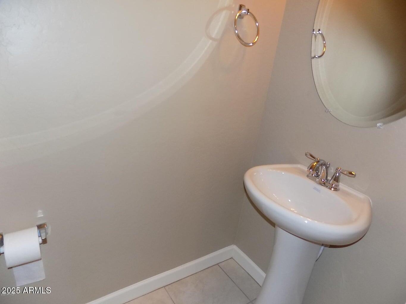 1367 South Country Club Drive, Unit 1076 Mesa, AZ 85210 - Photo 10 of 33 a bathroom with a sink toilet and mirror