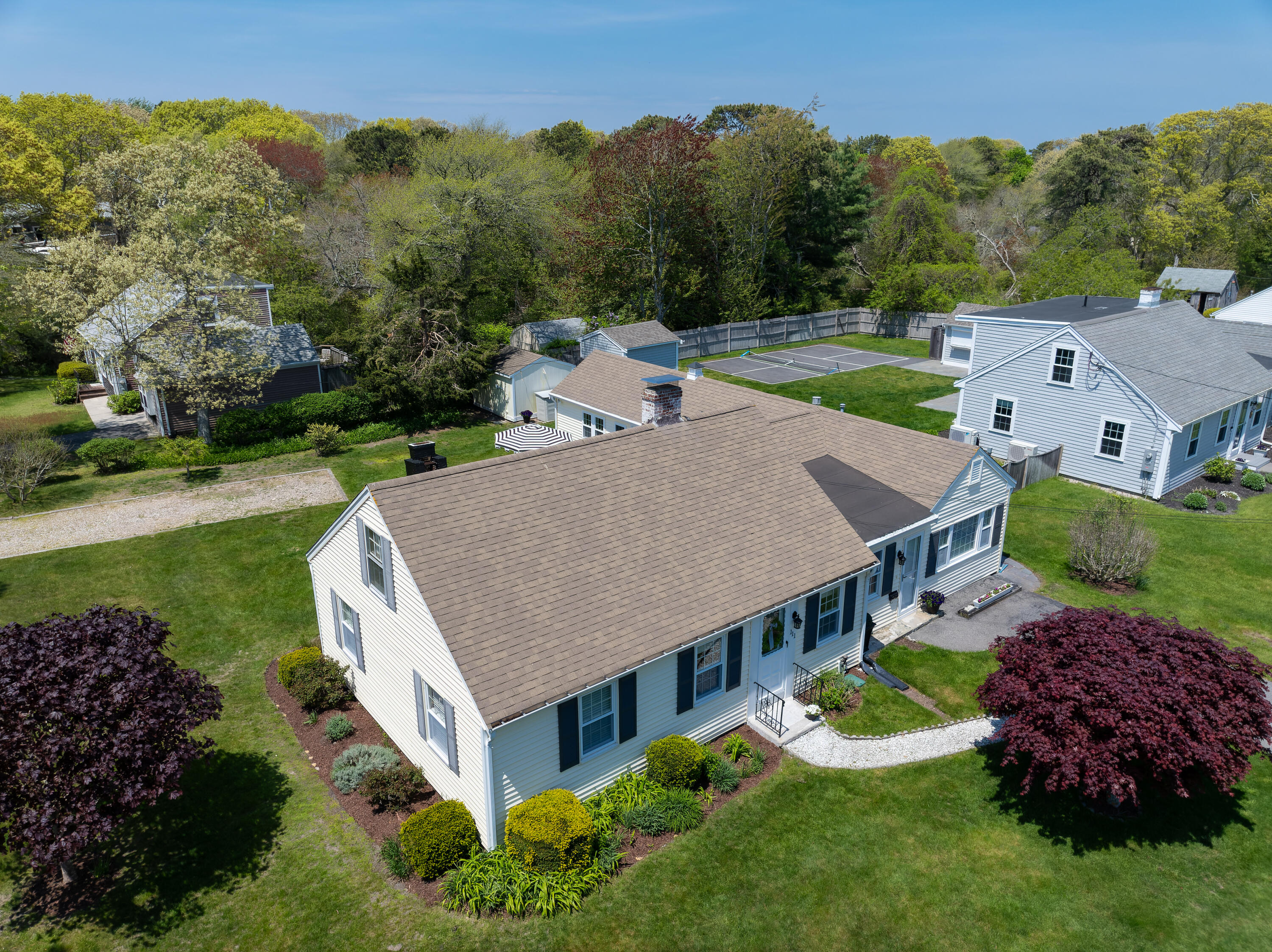 111 Lewis Road West Yarmouth, MA 02673 - Photo 2 of 43 an aerial view of a house with garden space and street view