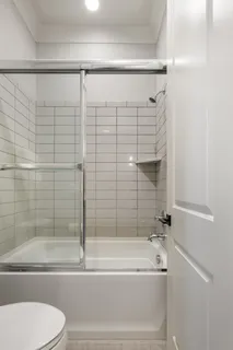 a bathroom with a shower and a bathtub