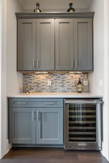 a kitchen with granite countertop a sink and a stove