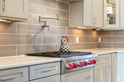 a close view of sink and cabinets