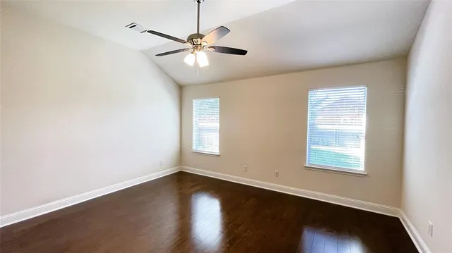 a bathroom with a double vanity sink mirror and bathtub