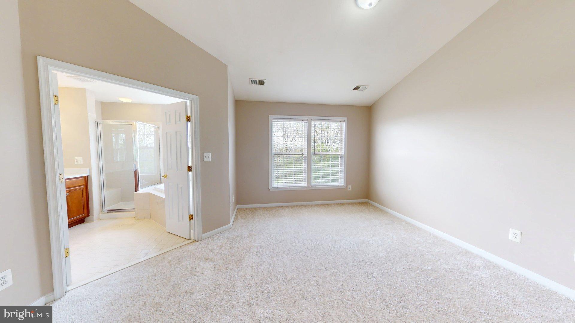 41867 Cinnabar Square Aldie, VA 20105 - Photo 13 of 26 an empty room with a bathroom and a window