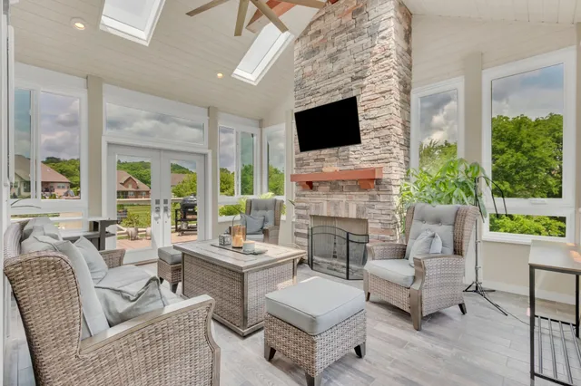 a spacious bathroom with a double vanity sink a large mirror a shower and bathtub