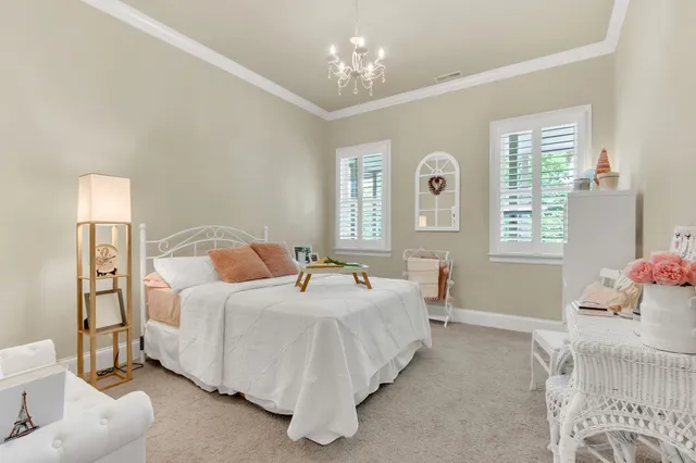 a view of an outdoor dining space with a table and chairs