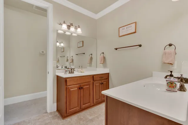 a view of roof deck with chair and potted plants