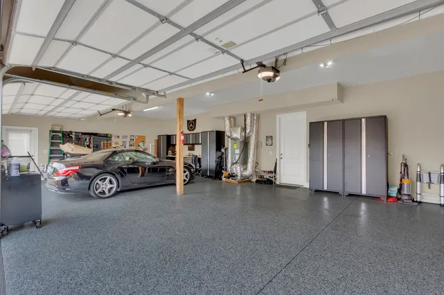 a front view of a house with a yard and sign board