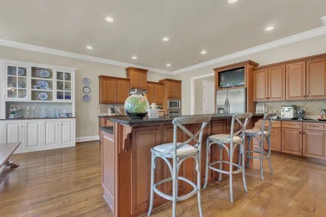 a open kitchen with lots of counter space and windows