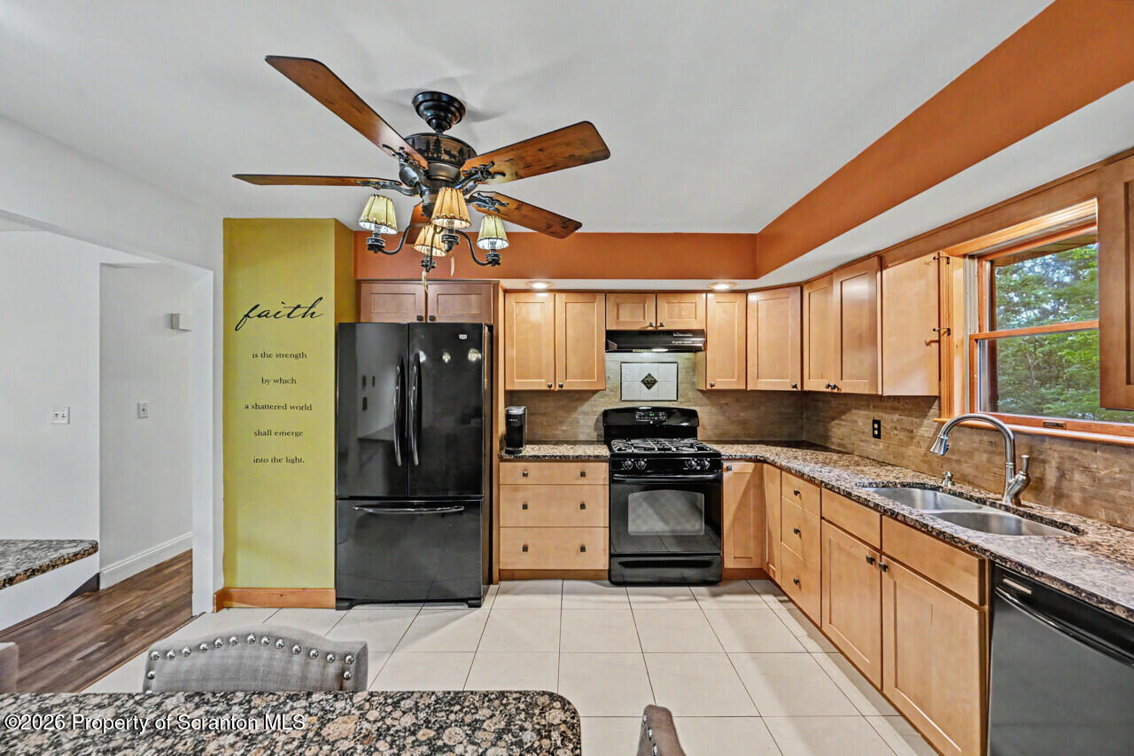 211 Buckingham Street Moscow, PA 18444 - Photo 25 of 83 a kitchen with stainless steel appliances granite countertop a refrigerator a stove and a sink