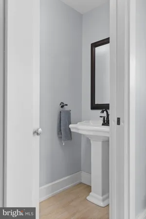 a bathroom with a sink a mirror and shower