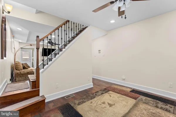 a view of entryway with stairs and wooden floor