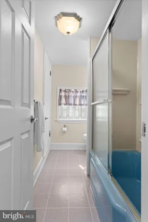 a bathroom with a tub and shower