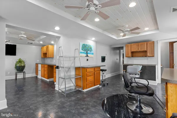 a living room with fireplace furniture and a flat screen tv