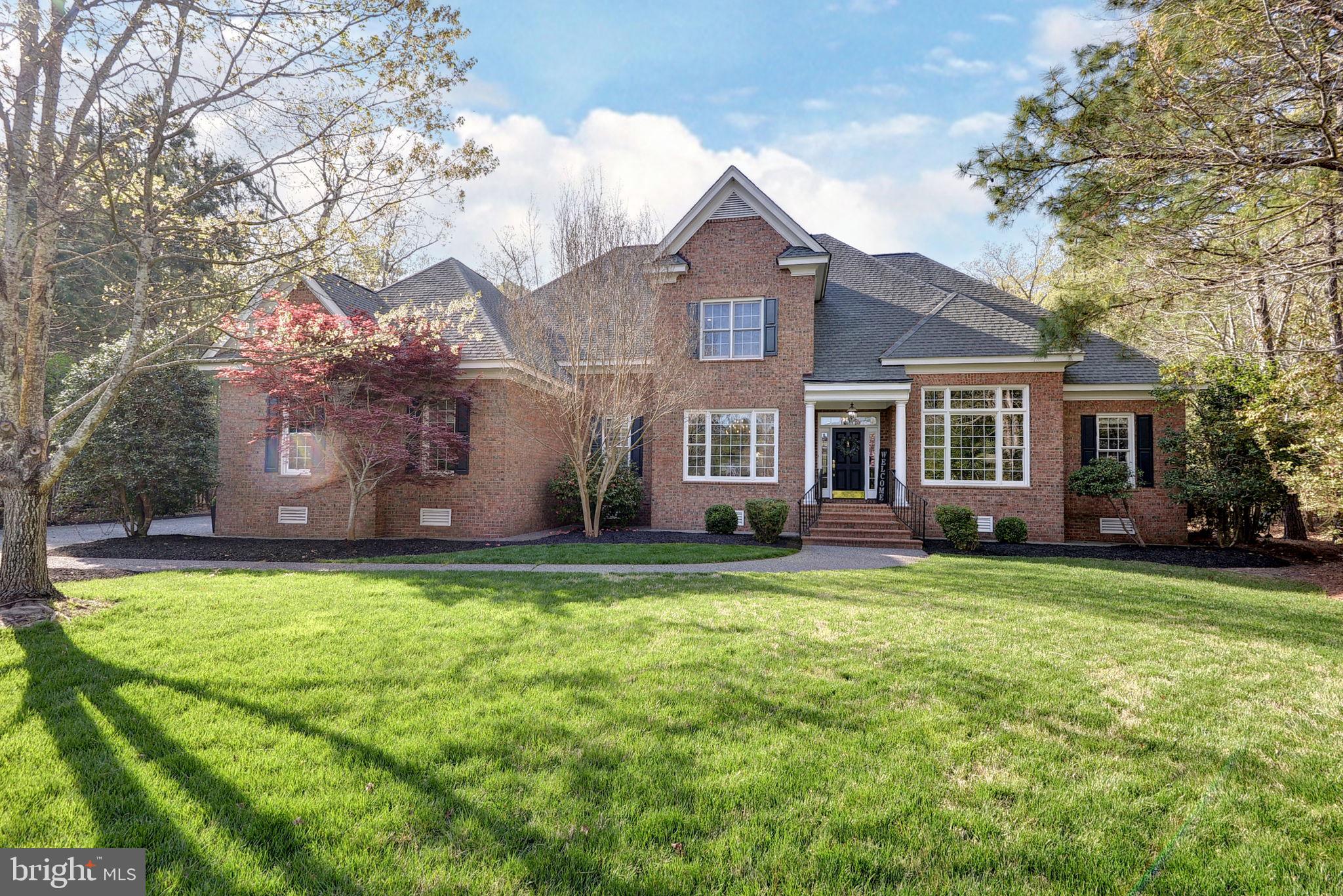 a front view of a house with a garden and porch
