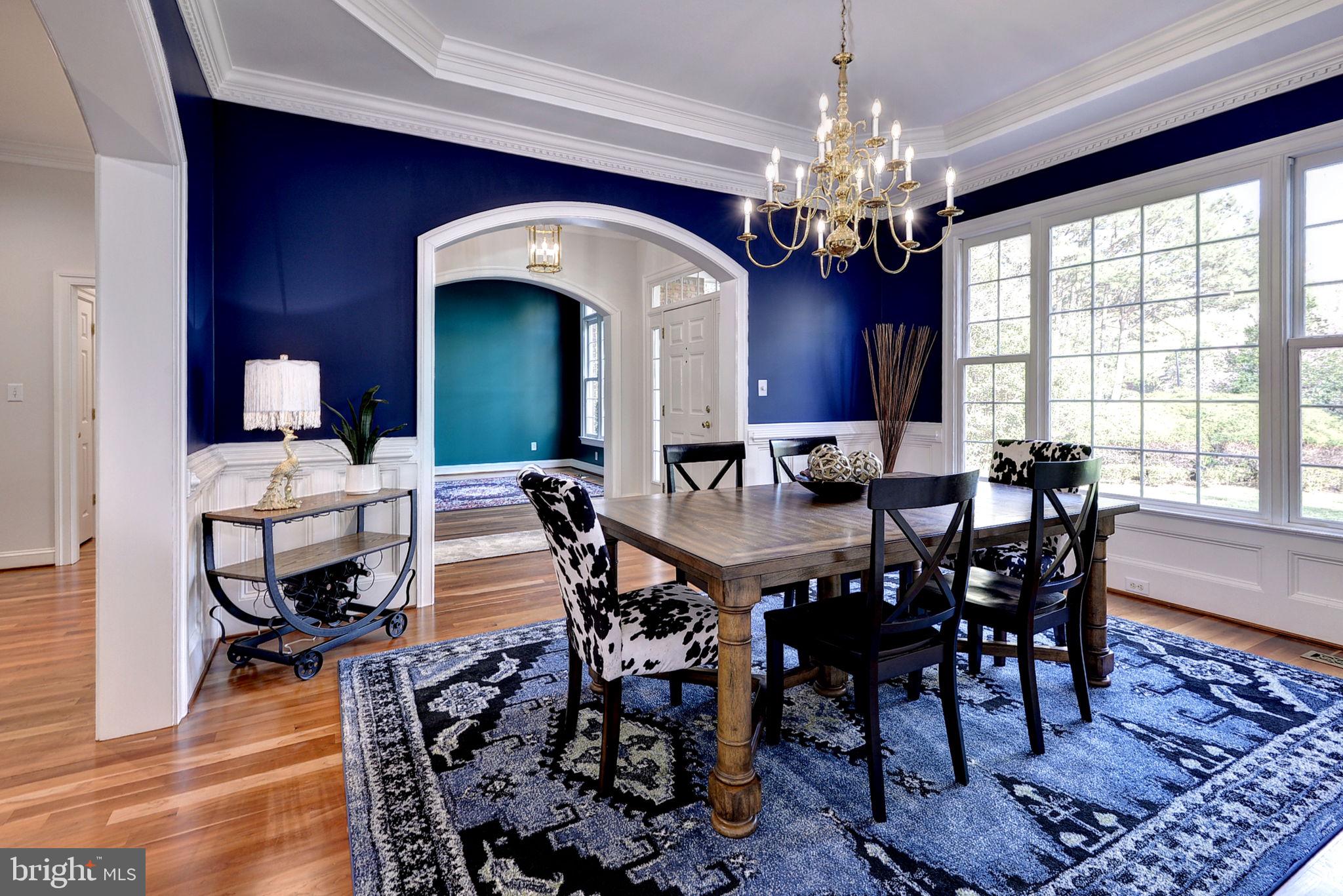 2076 Harpers Mill Road Williamsburg, VA 23185 - Photo 13 of 63 a view of a dining room with furniture and chandelier