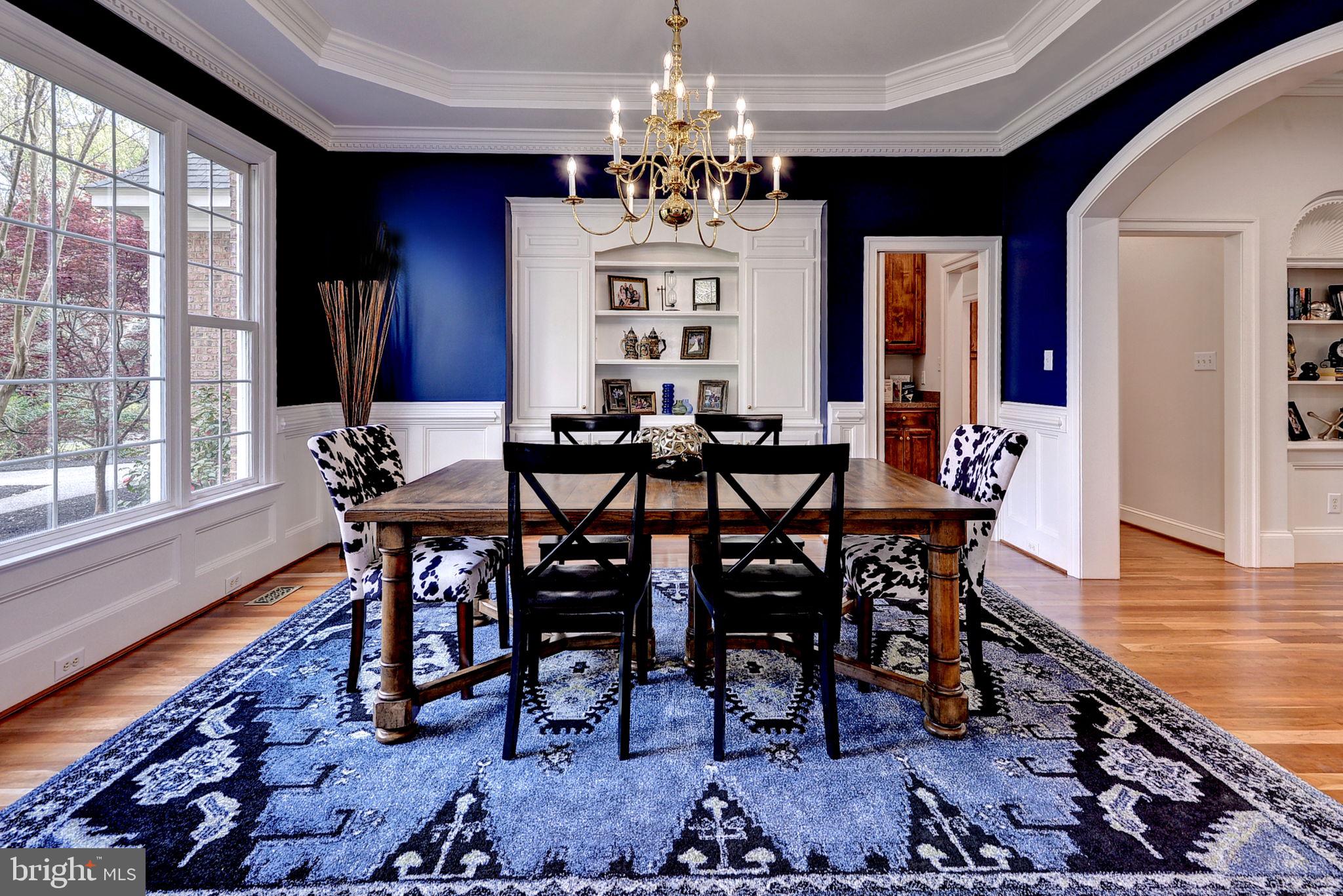 2076 Harpers Mill Road Williamsburg, VA 23185 - Photo 14 of 63 a view of a dining room with furniture wooden floor and chandelier