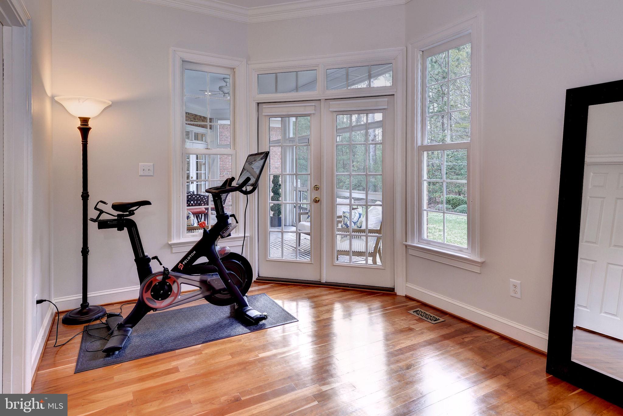 2076 Harpers Mill Road Williamsburg, VA 23185 - Photo 21 of 63 a view of a room with gym equipment