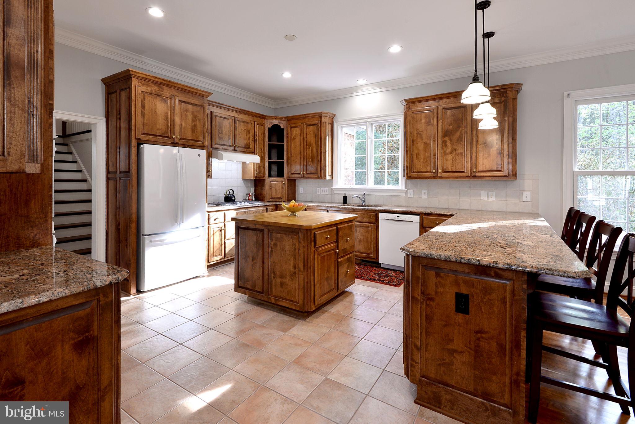 2076 Harpers Mill Road Williamsburg, VA 23185 - Photo 26 of 63 a kitchen with stainless steel appliances granite countertop a stove a sink a oven and a refrigerator