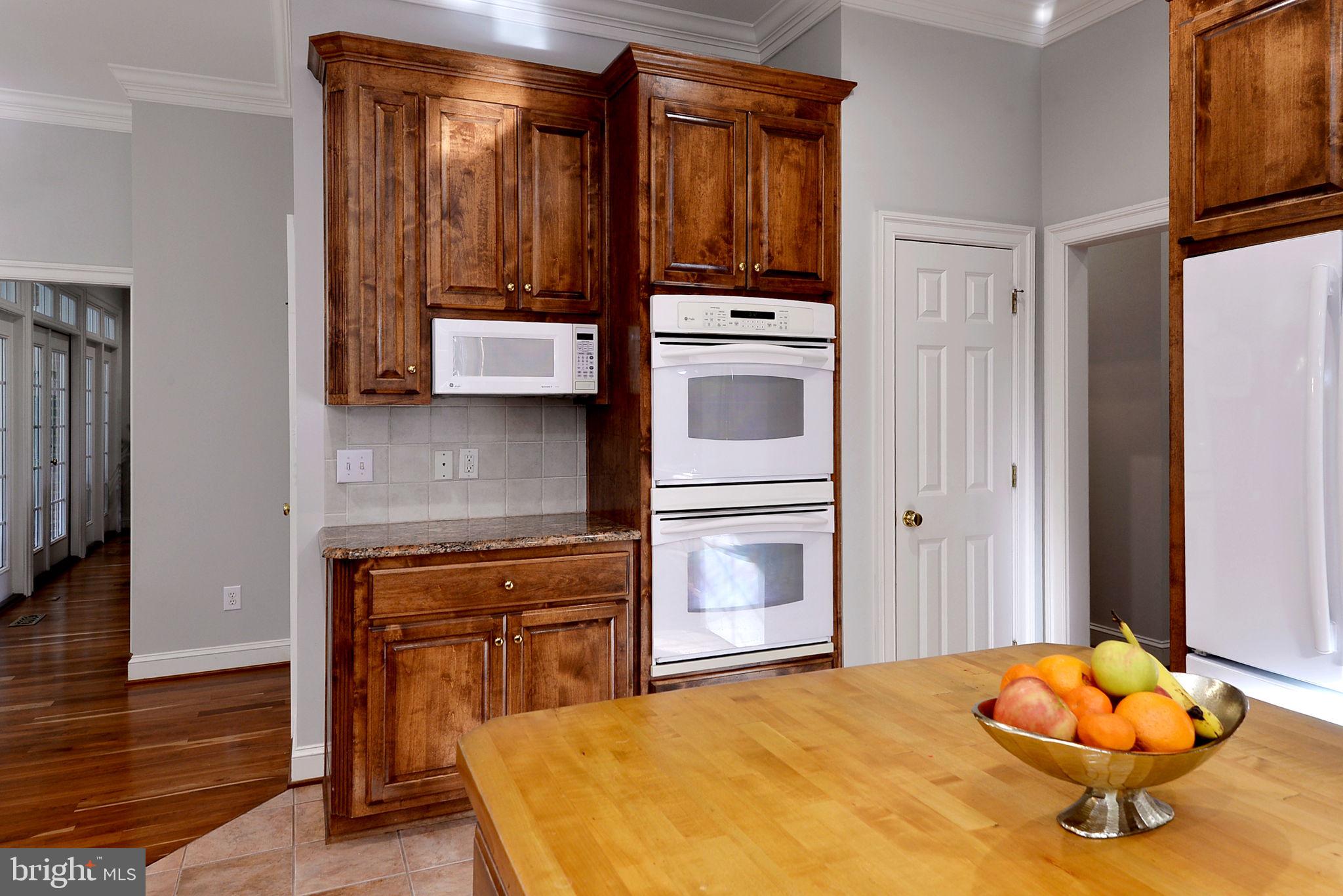 2076 Harpers Mill Road Williamsburg, VA 23185 - Photo 28 of 63 a kitchen with stainless steel appliances granite countertop a stove and a refrigerator