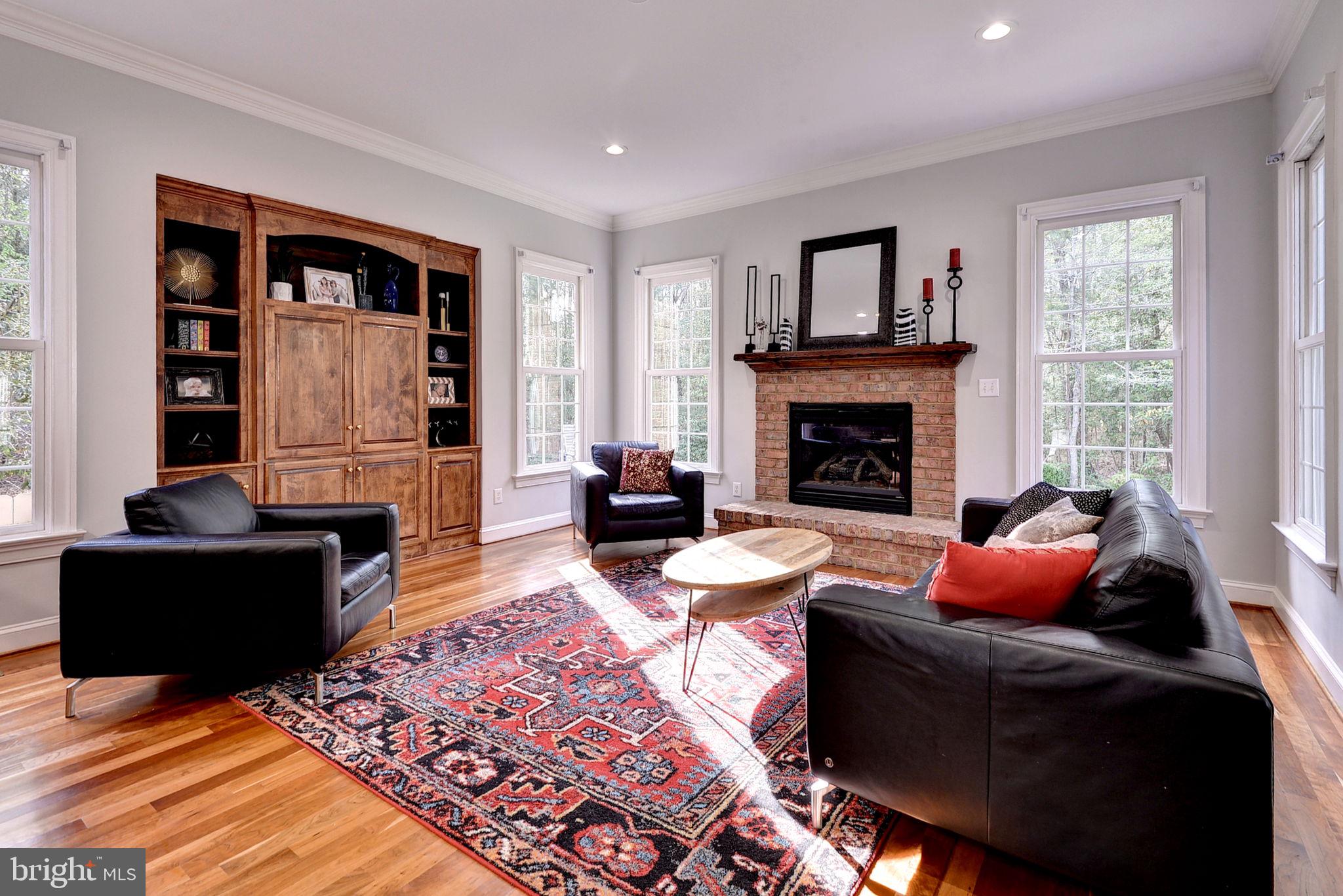 2076 Harpers Mill Road Williamsburg, VA 23185 - Photo 32 of 63 a living room with furniture fireplace and window