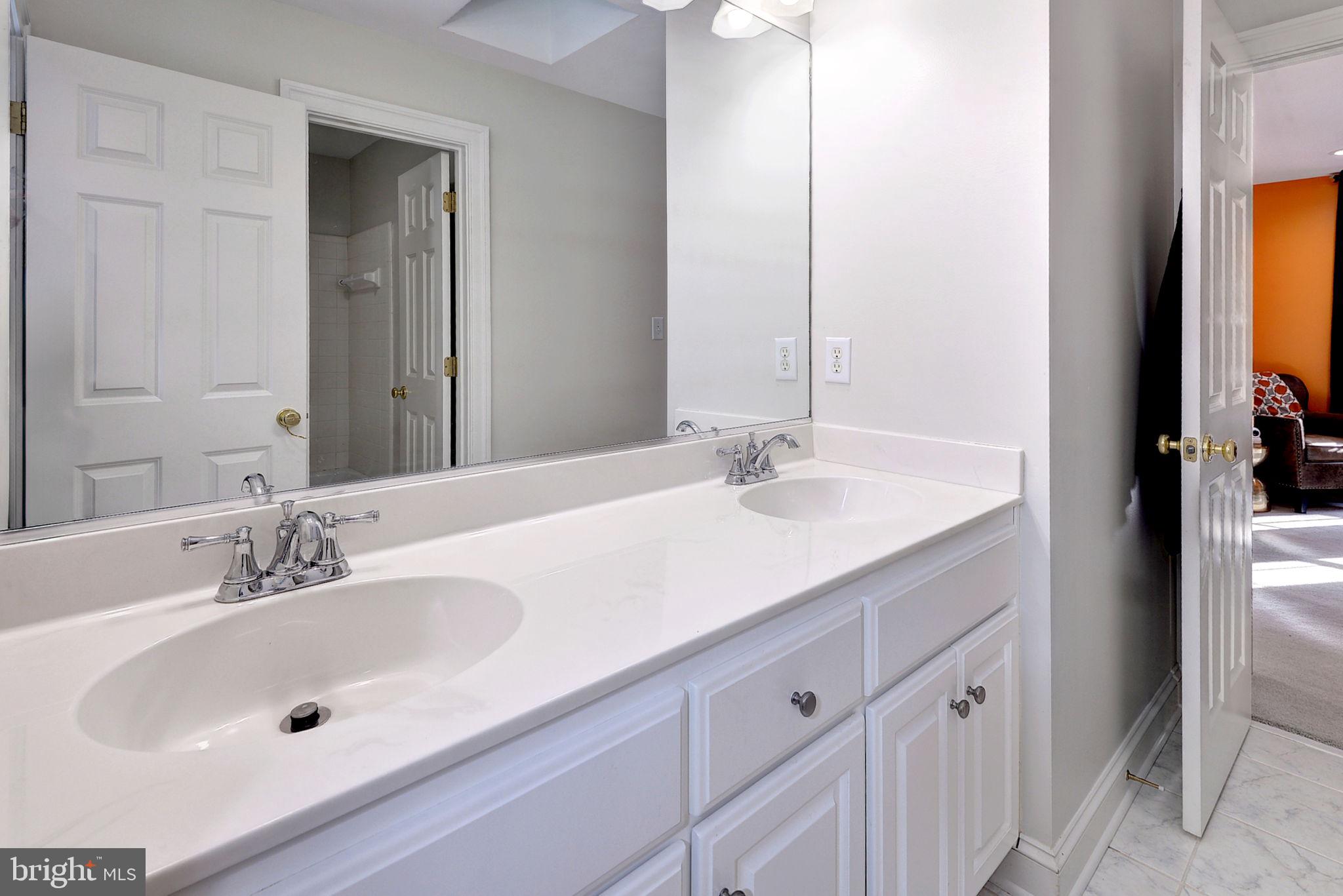 2076 Harpers Mill Road Williamsburg, VA 23185 - Photo 36 of 63 a bathroom with a sink and a mirror