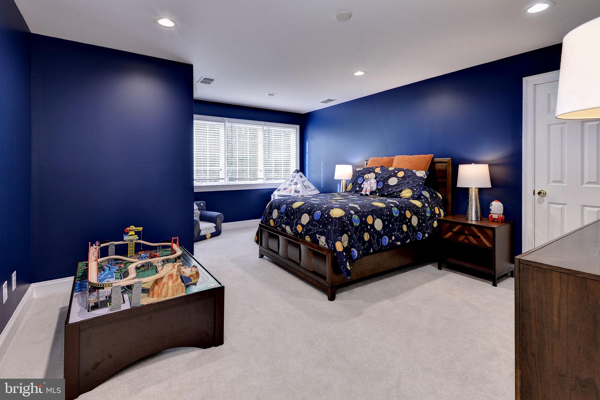 2076 Harpers Mill Road Williamsburg, VA 23185 - Photo 37 of 63 a bed room with a bed and a window