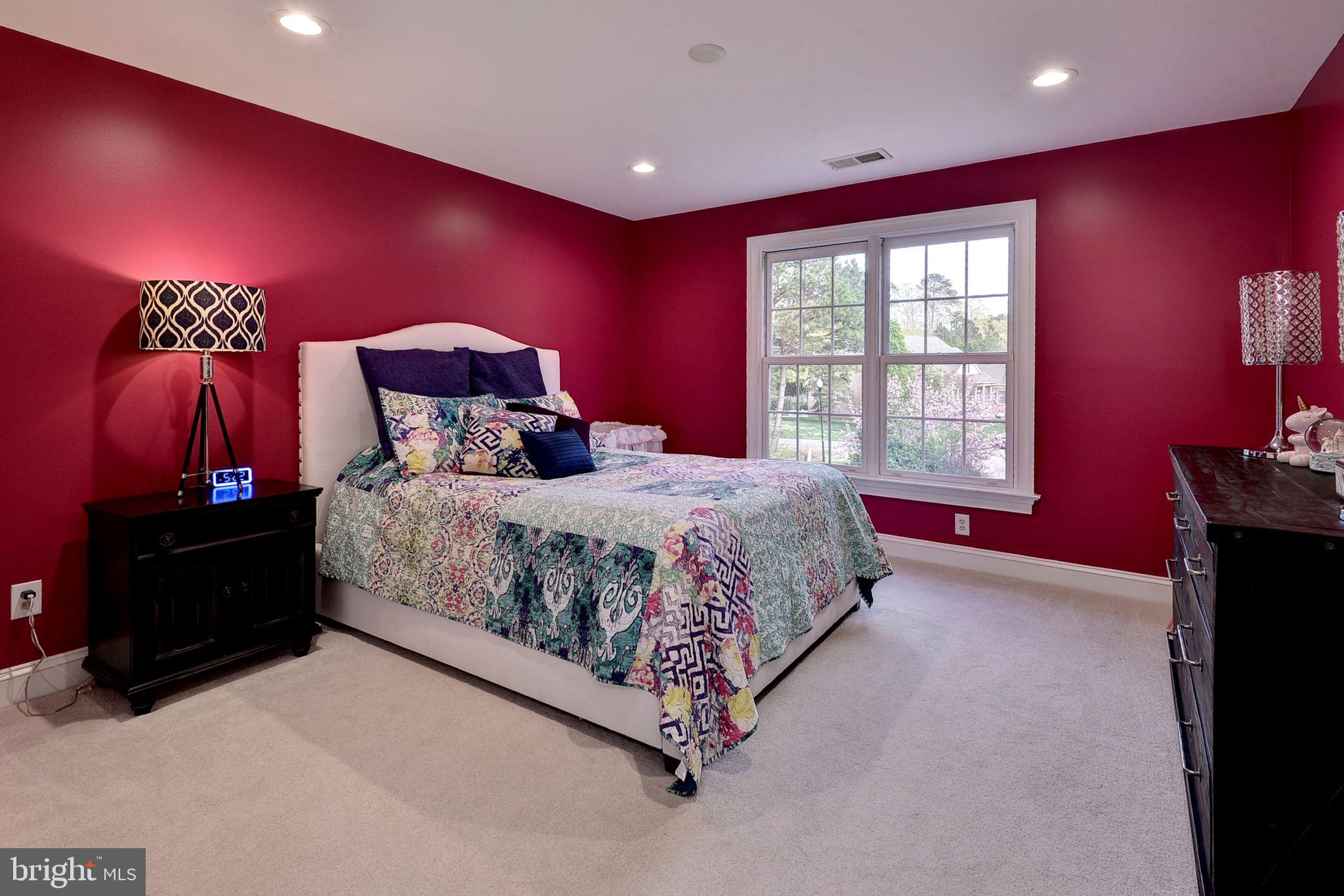 2076 Harpers Mill Road Williamsburg, VA 23185 - Photo 38 of 63 a bedroom with a bed and a closet