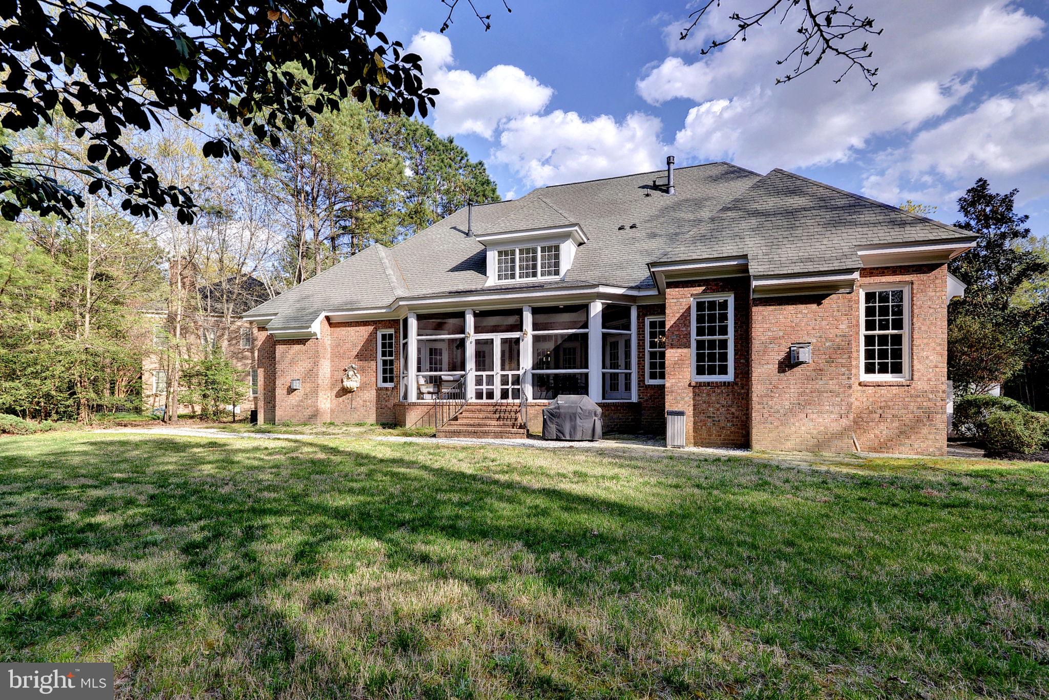 2076 Harpers Mill Road Williamsburg, VA 23185 - Photo 47 of 63 a front view of a house with a yard