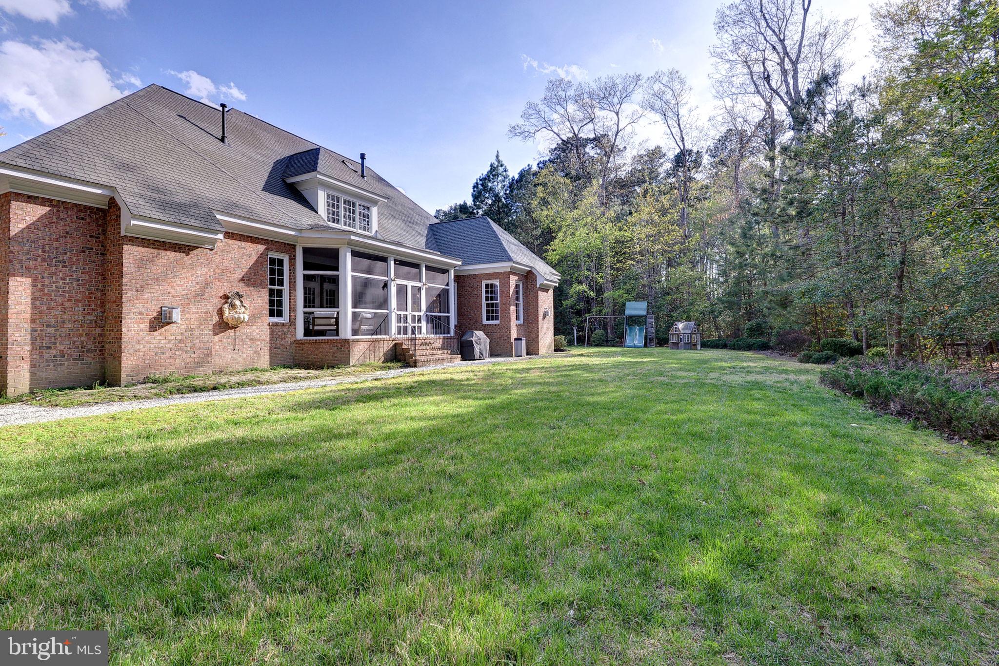 2076 Harpers Mill Road Williamsburg, VA 23185 - Photo 49 of 63 a front view of house with yard and green space