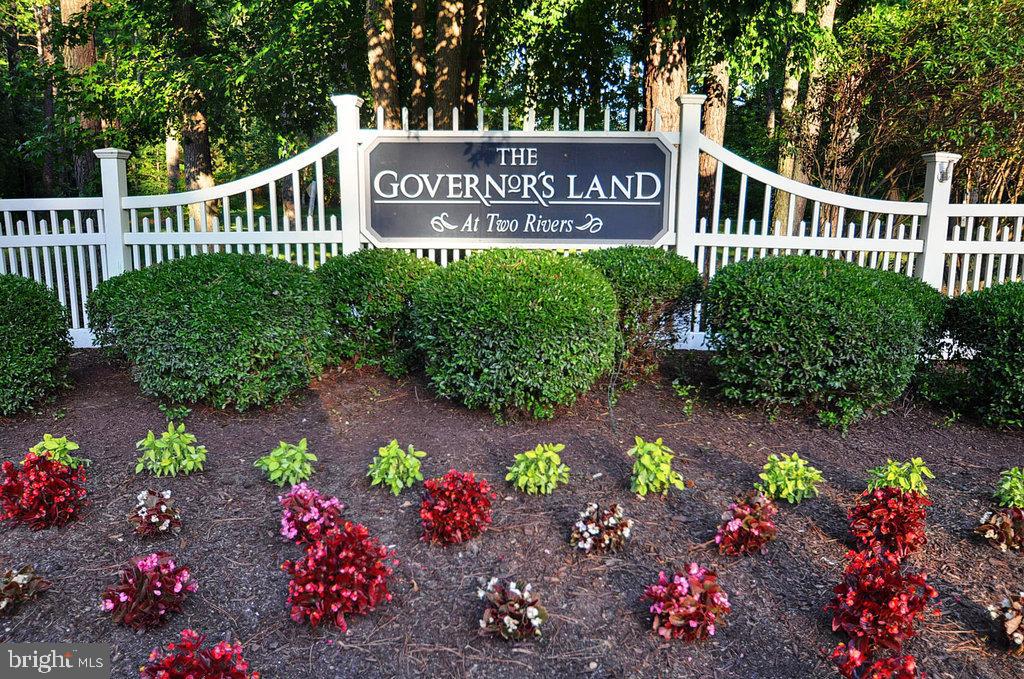 2076 Harpers Mill Road Williamsburg, VA 23185 - Photo 50 of 63 a view of a sign board in front of flowers