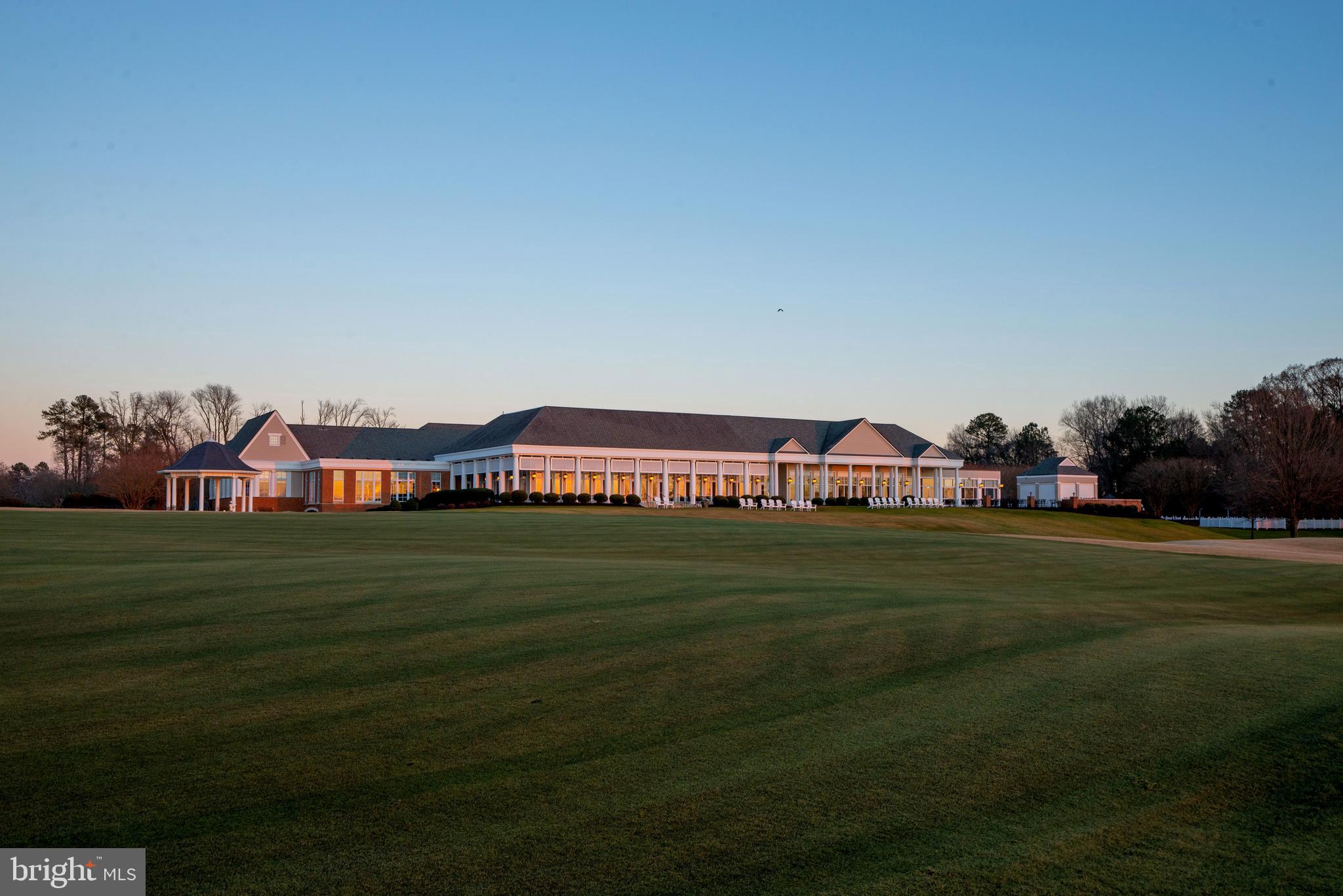 2076 Harpers Mill Road Williamsburg, VA 23185 - Photo 52 of 63 a front view of a house with a yard table and chairs