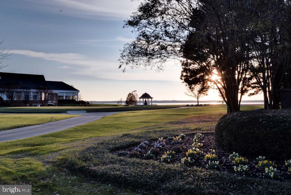 2076 Harpers Mill Road Williamsburg, VA 23185 - Photo 61 of 63 a view of a swimming pool with an outdoor space and seating area