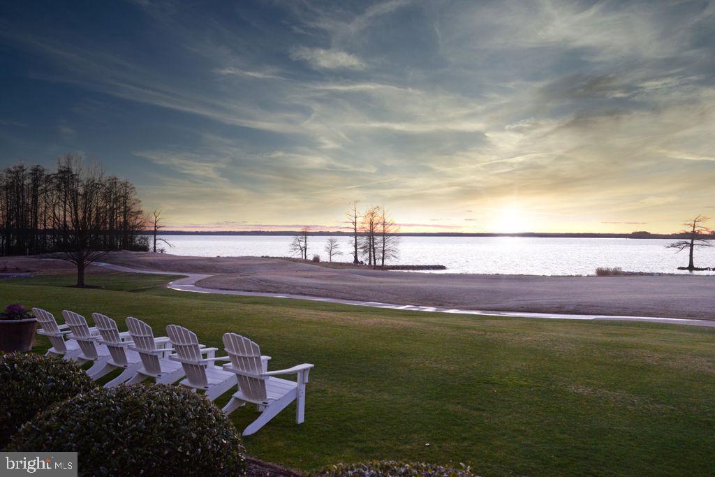 2076 Harpers Mill Road Williamsburg, VA 23185 - Photo 62 of 63 a view of a swimming pool with an outdoor space and seating area