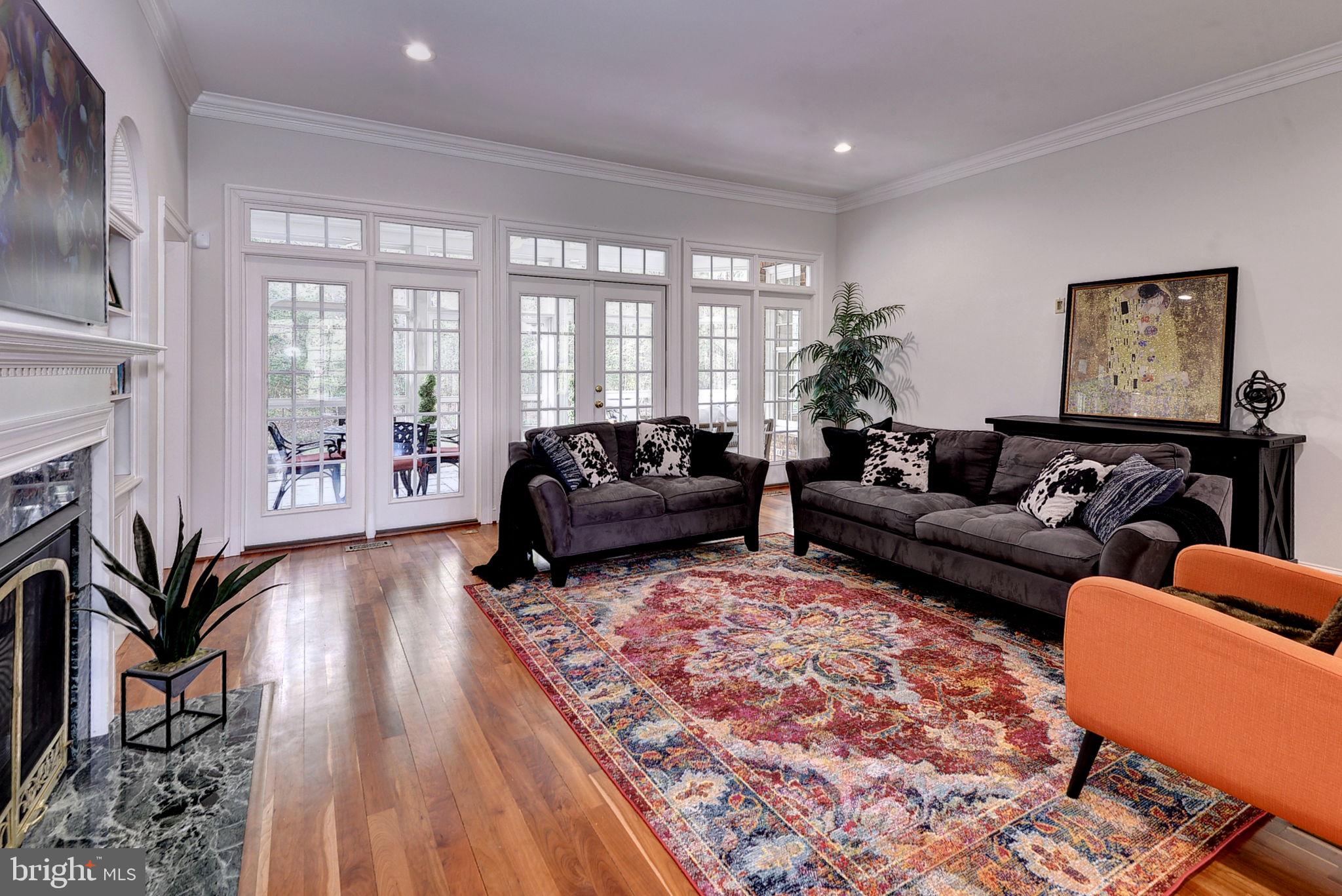 2076 Harpers Mill Road Williamsburg, VA 23185 - Photo 9 of 63 a living room with furniture fireplace and a large window