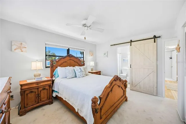 a bathroom with a toilet a sink and a mirror