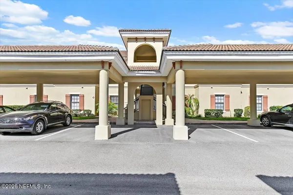 a view of a car park in front of a building