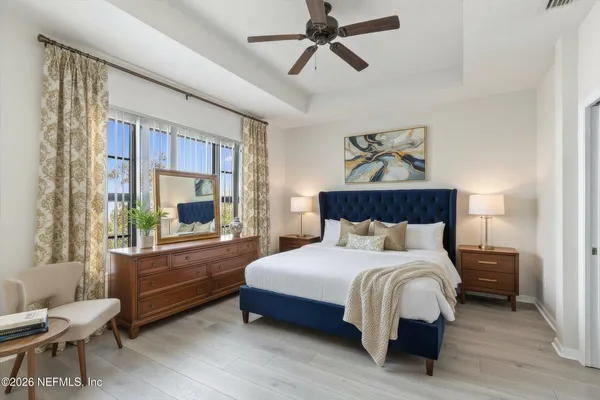 a bedroom with a bed and a couch