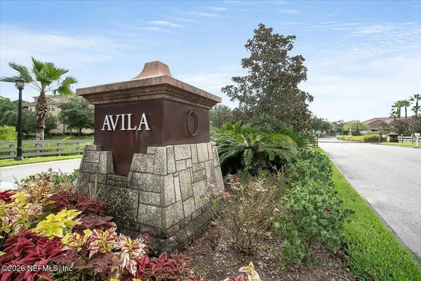 a sign of a park sitting in front of a house