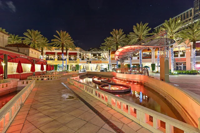 a view of a house with swimming pool and sitting area