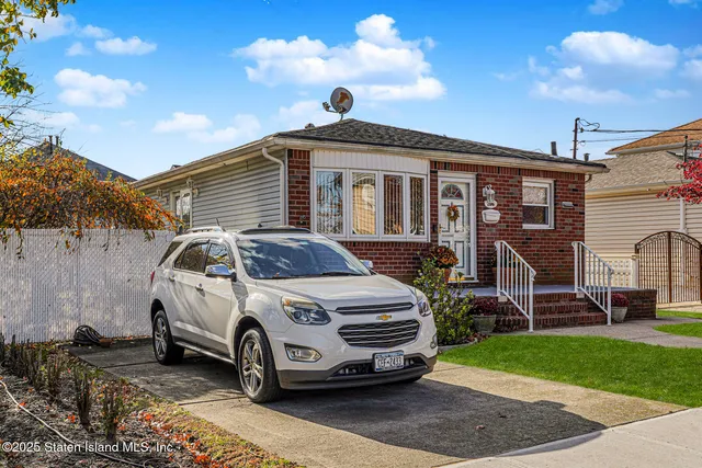 a car parked in front of a house