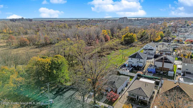 an aerial view of a house with a lake view