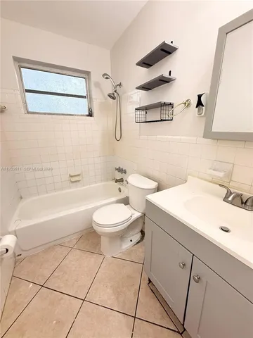 a bathroom with a sink a toilet and a bathtub