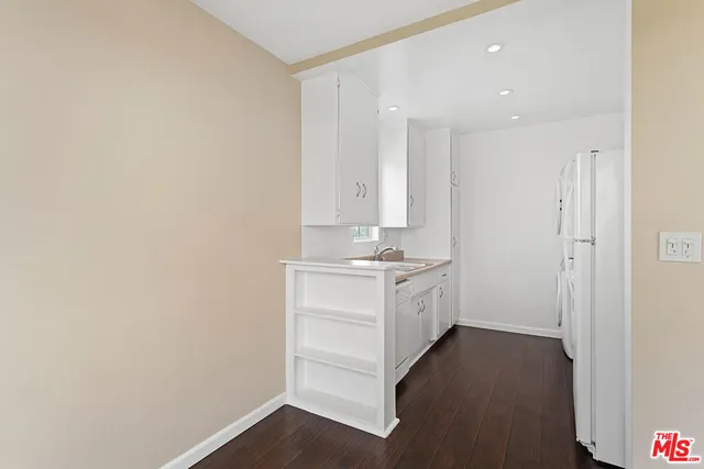 a bathroom with a sink vanity and a mirror