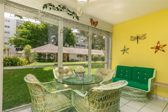 a view of an outdoor dining space with furniture