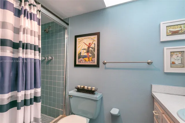 a bathroom with a shower curtain